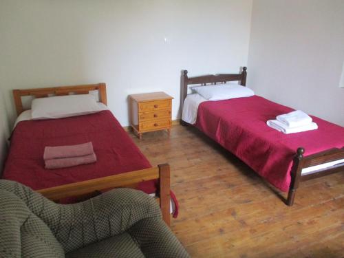 A bed or beds in a room at Karpasi House