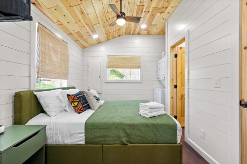 a bedroom with a bed in a tiny house at Block of 5 Lodges at Eden Reserve - For Groups in Williamstown