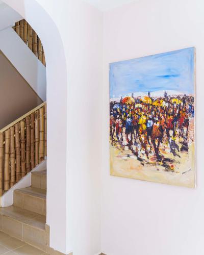 a painting of a crowd of people on the beach at Aurora Smart Residence, Wuse 2, Abuja in Abuja