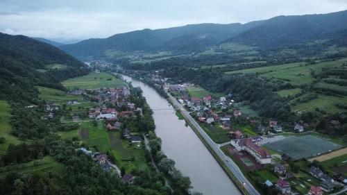 an aerial view of a town next to a river at Willa Wioletta in Tylmanowa