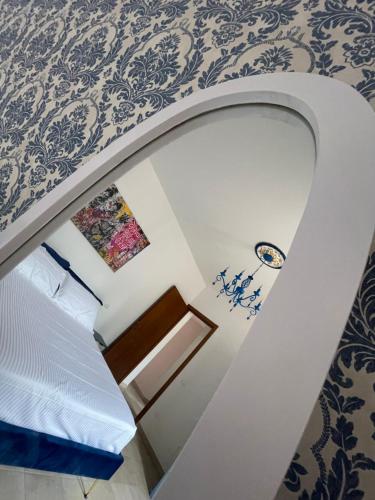 a stairway leading to a room with a bed at Antica Residenza Colle in Nocera Umbra