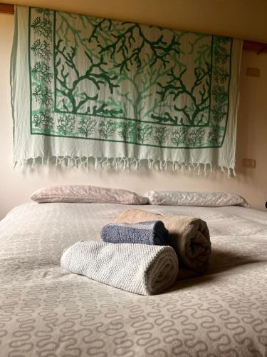 Een bed of bedden in een kamer bij Agriturismo Il Sorbo Appartamento Menta