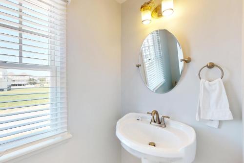 a bathroom with a sink and a mirror at Drum #6A-CAC in Buxton