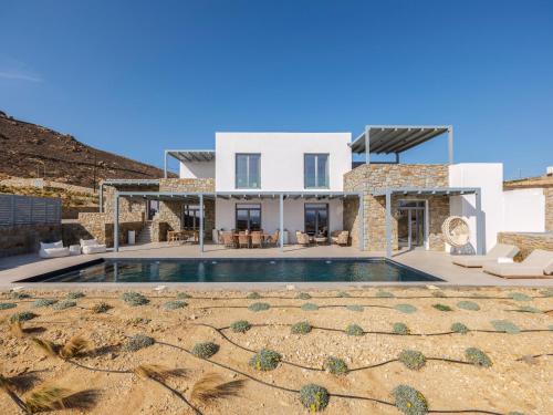 a view of a villa with a swimming pool at Villa Meraviglia Elia Mykonos in Elia Beach