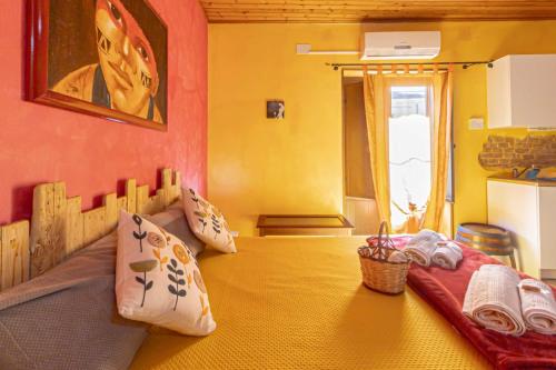a bedroom with a bed with pillows on it at Casa "a chiazzetta" in Castelbuono