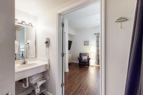 a bathroom with a sink and a mirror at Shores of Panama 1507 in Panama City Beach