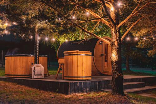 a yurt in a park at night with lights at Ossona Rest in Częstochowa
