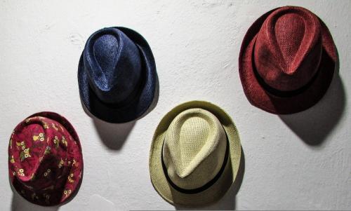 a group of hats hanging on a wall at Depis Place And Apartments Naxos Depis Castle Renata Luxury Apartments-Double Studio in Naxos Chora