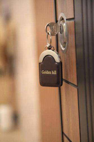 a lock on a door with the words golden hill at Golden hill Vinča in Vinča