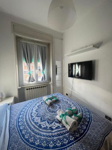 a bedroom with a bed with towels on it at CASA GUGHI in Rapallo