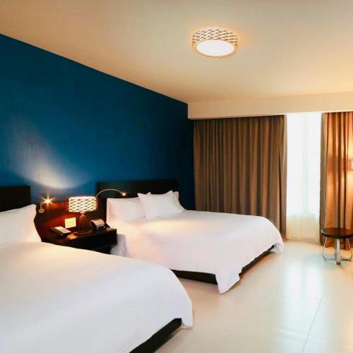 Un ou plusieurs lits dans un hébergement de l'établissement Hampton by Hilton Panama
