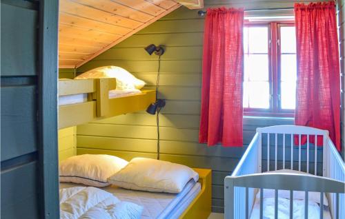 a small room with a bunk bed and a crib at 3 Bedroom Cozy Home In seral in Åseral