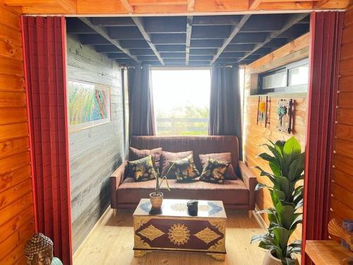 a living room with a couch and a table at PEZ HOUSE in Pichilemu