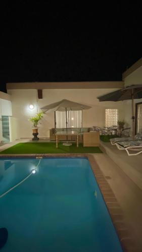 a house with a swimming pool at night at Lerato's in Vanderbijlpark