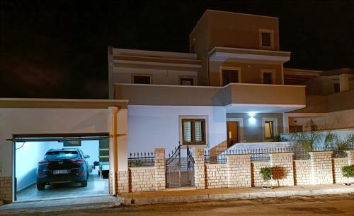 a car in a garage in a house at night at Casa Mandorle in Ugento