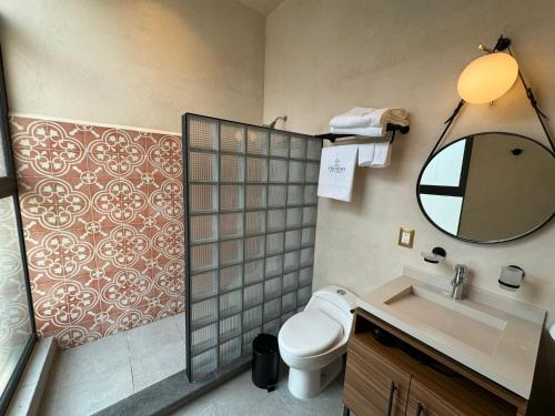 a bathroom with a toilet and a sink and a mirror at Studio with all you need next to Bellas Artes in Mexico City