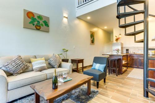 a living room with a couch and a table at Louis' Apartments in Placencia Village