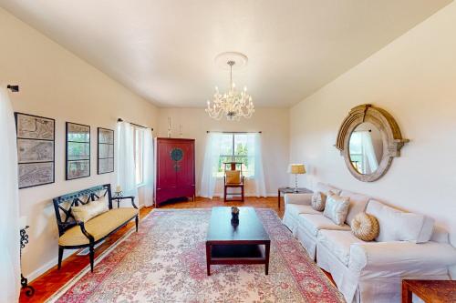 a living room with a couch and a table at Vineyard Estate in Cotati