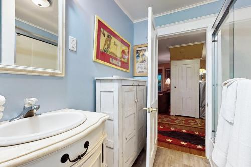 a bathroom with a sink and a mirror at Town of Rehoboth Beach --- 206 Norfolk St in Rehoboth Beach