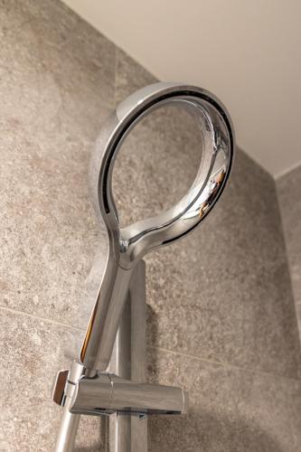a chrome mirror sitting on top of a counter at Arluxia in Auckland