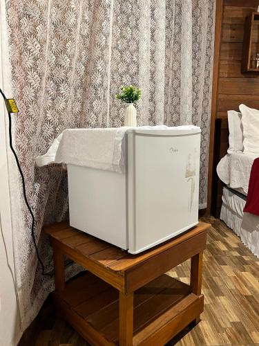 Una cama o camas en una habitación de Pousada e Restaurante Sumaúma