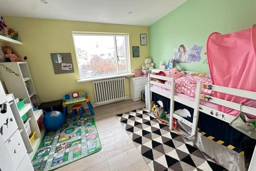 a childs bedroom with a pink bunk bed at House in Hlíðarvegur, Kópavogur - Birta Rentals in Reykjavík