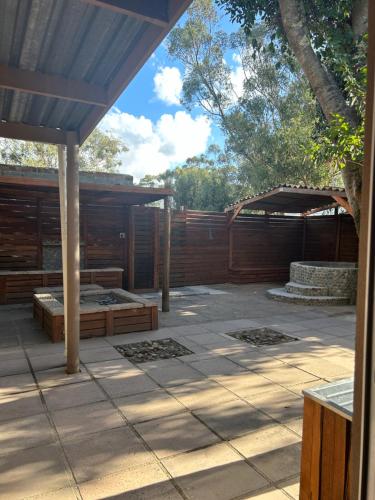 a patio with two beds and a pavilion at STAY In TEHAMA in Cape Town