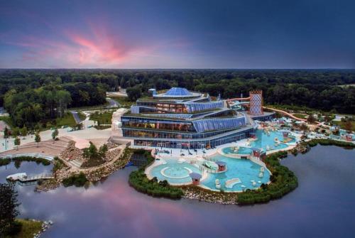 an aerial view of a resort with a pool at 135m2 - Villa, 5 min to the park - DISNEY MAGICAL HOMES, PARIS in Magny-le-Hongre