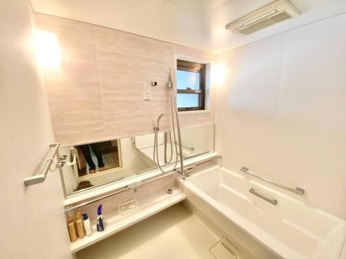 Un baño de 名古屋駅徒歩15分 沙羅居Suite Japanesque 貸切戸建110平米最大12名無料駐車場付