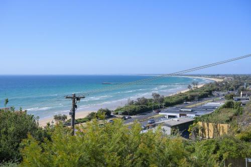 a view of a beach and the ocean at Pudding's Home Luxury Oceanfront Escape in Frankston