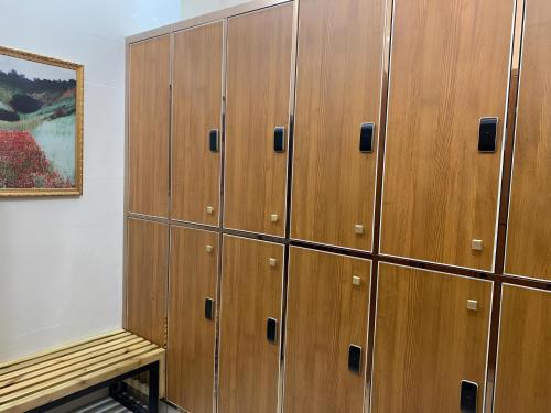 a row of wooden lockers in a room at ST Vegas Hotel in Ban Nong-Heo