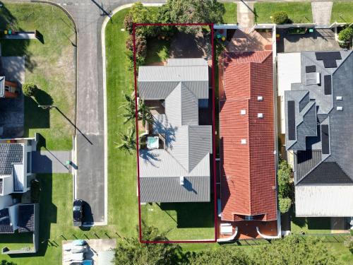 an overhead view of a house with a roof at Reflections at Sunset Beach in Soldiers Point
