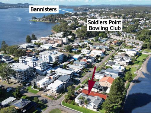 an aerial view of a town next to the water at Reflections at Sunset Beach in Soldiers Point