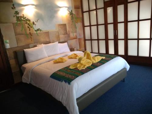 Un pat sau paturi într-o cameră la Hotel Villa del Sant Boutique