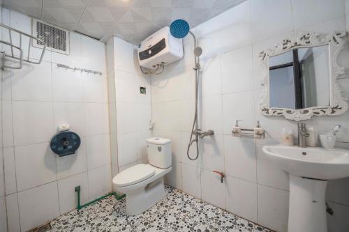 a bathroom with a toilet and a sink at Central Sapa Serenity Homestay in Sa Pa