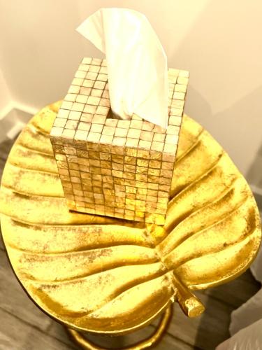 a plate of food with a basket of bread at Eleni’s Charming Studio in North Beach