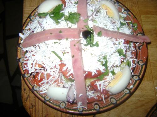 a plate of food on a wooden table at Guest House Todorini kashti in Koprivshtitsa