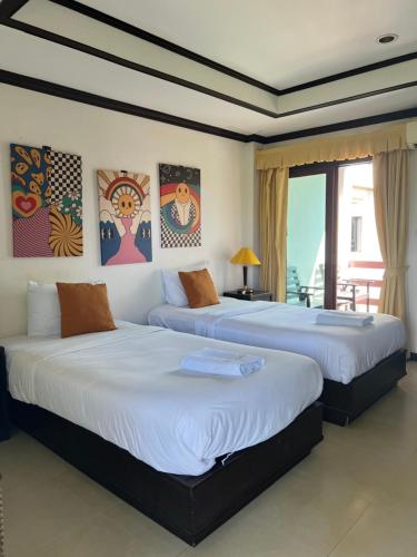 Postel nebo postele na pokoji v ubytování Samui Seabreeze Place