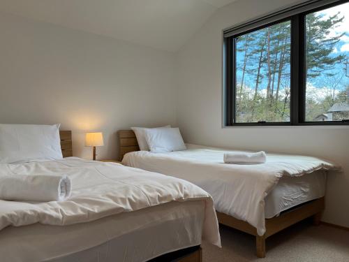 Llit o llits en una habitació de Latitude 36