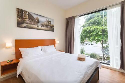 Posteľ alebo postele v izbe v ubytovaní Penang Hill Lodge