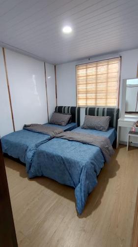 Ένα ή περισσότερα κρεβάτια σε δωμάτιο στο D'Maro Hut Mesilou