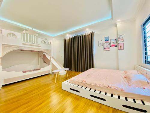 a bedroom with a large bed in a room at Lemon House - Service Apartment - Ngoc Thuy - Long Bien in Hanoi