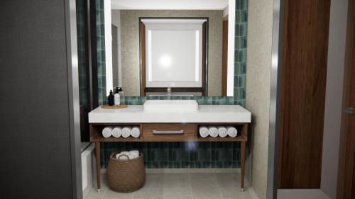 a bathroom with a sink and a mirror at Black Desert Resort in Ivins