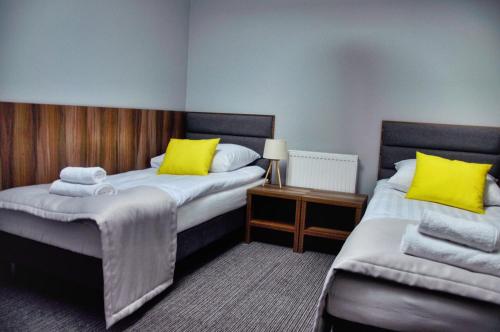 Postel nebo postele na pokoji v ubytování Hotel Klondaik Corner