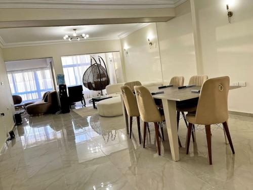 a dining room with a table and chairs at 3BR Nile View Zamalek island Abu El Feda Luxury in Cairo