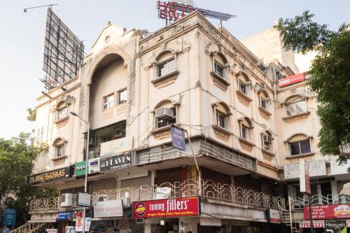 an old building on the corner of a street at Flagship Hotel Swell in Ahmedabad