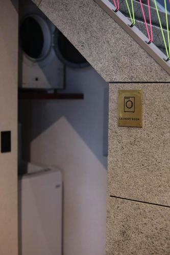 a sign that says no smoking is on a wall at ＩＲＡＧＯ　ＡＲＴ　 ＨＯＴＥＬ 　THECAPE in Irago