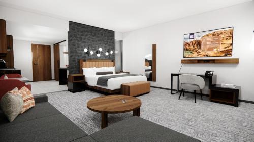 a hotel room with a bed and a desk at Black Desert Resort in Ivins