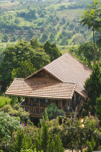 a house with a tile roof on a hill at SEN VILLA Boutique in Bao Loc