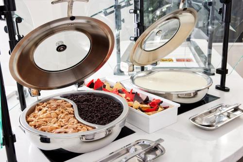 a buffet of food on a counter in a store at Staybridge Suites Silicon Valley - Milpitas by IHG in Milpitas